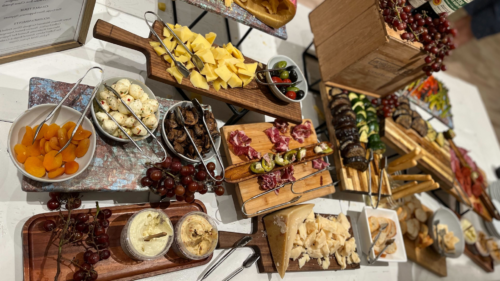 photograph of cheeses with fruits and meats